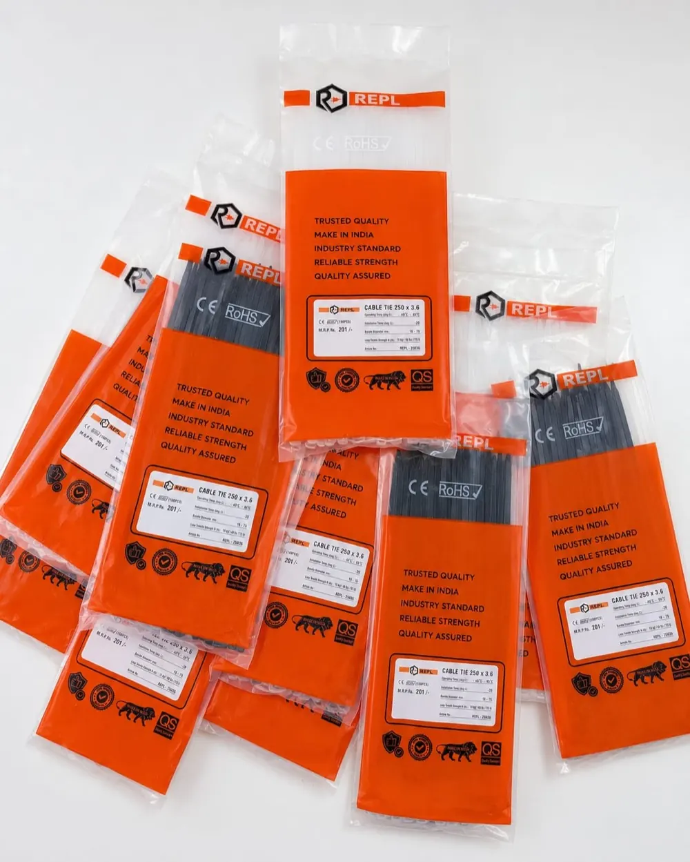 REPL cable tie packs in natural white and natural black, 100 ties per pack, in orange REPL packaging.